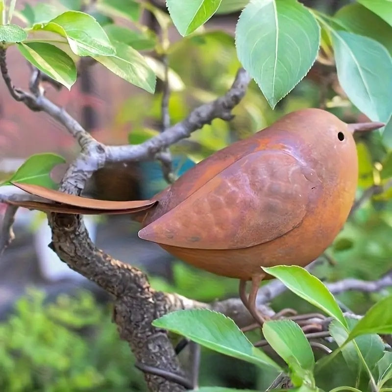 Close-up of rustic iron bird ornament showing aged metal texture and fine detail