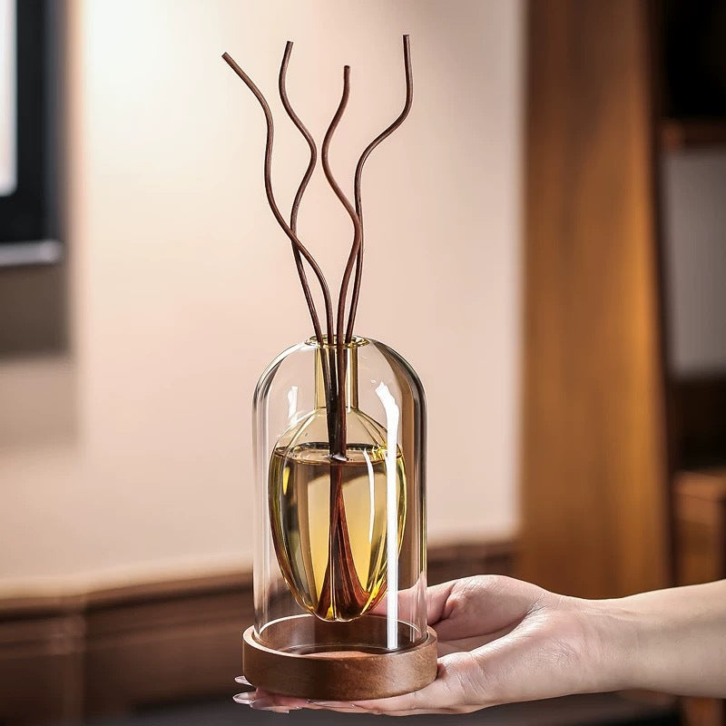 Reed diffuser with natural rattan reeds in a Bergamot Citrus scent on a marble surface
