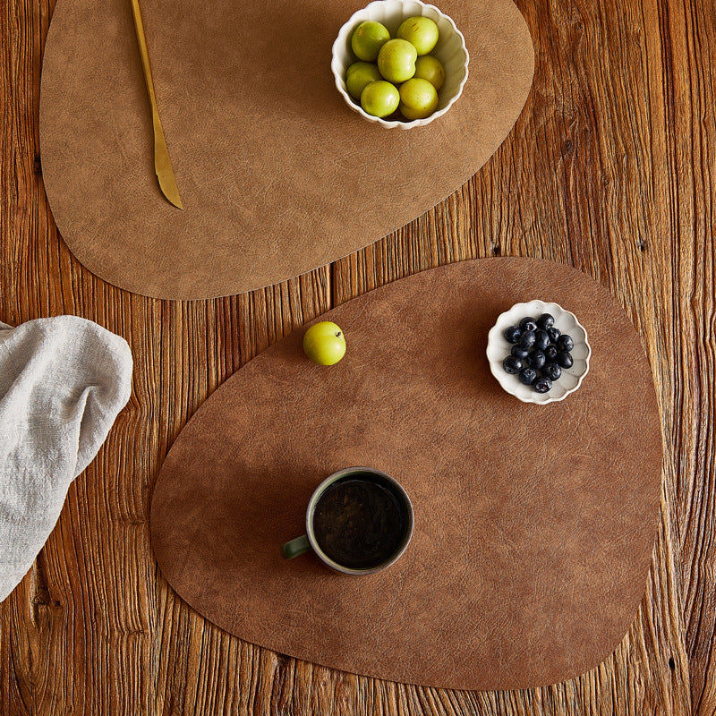 Tuscany leather placemat in Walnut Brown on a rustic dining table — curated for Foodies